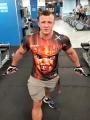 Pomarańczowa Koszulka Męska na Siłownię Play Hard Or Go Home Chucky